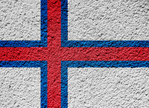 Flag of Faroe Islands on a textured background. Concept collage.