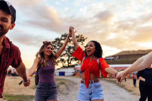istock Young cheerful couples having fun at music festival 1475631694