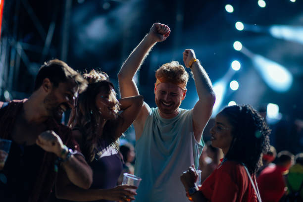 istock Happy enthusiastic friends at concert 1475631700