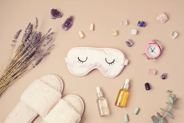 istock Healing chakra crystals, lavender and sleeping mask. Improving sleep quality with gemstones. Natural treatment of insomnia 1475631995