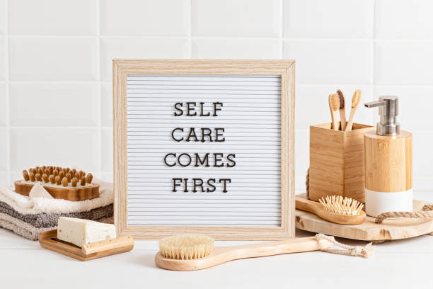 istock Bathroom styling and organization. Letter board with text Self care comes first. Organic lifestyle and skin care products. 1475632046