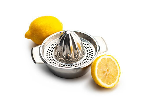 Kitchen Utensils: Citrus Squeezer, chrome citrus juicer with one ripe cat yellow lemon  and one uncut lemon ,isolated on white. High angle view.