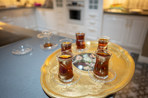 Turkish tea in a tea glass served in traditional style at home