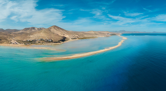 Awesome mid level aspect aerial panoramic view of the beautiful tropical looking beach, lagoon and sand dunes at SotaventoRisco del Paso beach near Costa Calma on Fuerteventura Canary Islands