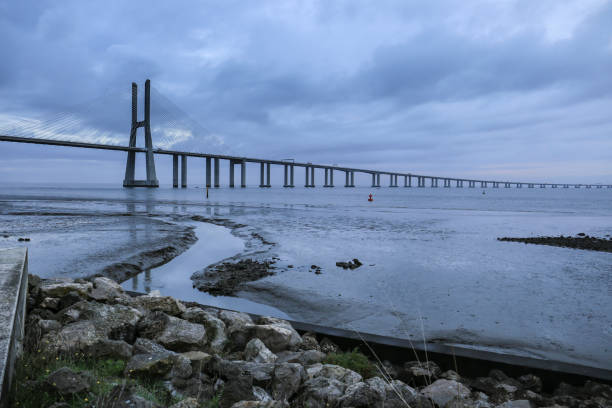 istock The Vasco Da Gama bridge on a cloudy day 1475635913