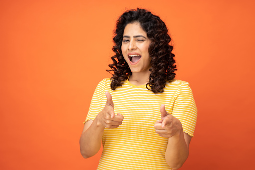 Portrait of happy smiling joyful woman winking and flirting