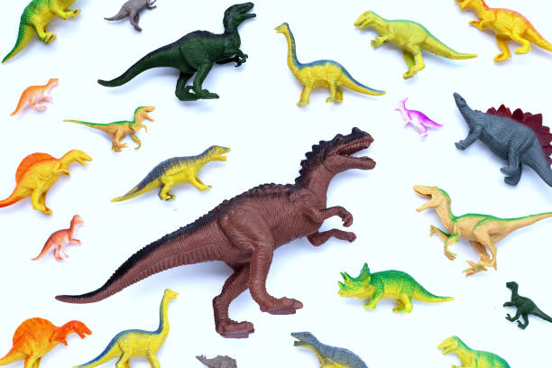 istock Plastic dinosaur toys on white background. Top view 1475643278