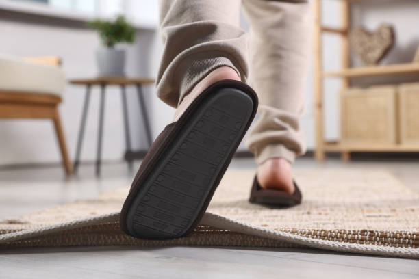 istock Man tripping over rug at home, closeup 1475645165