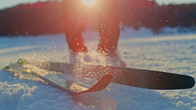 SPEED RAMP SLO MO Cross-Country skis fallen on the snow at sunset