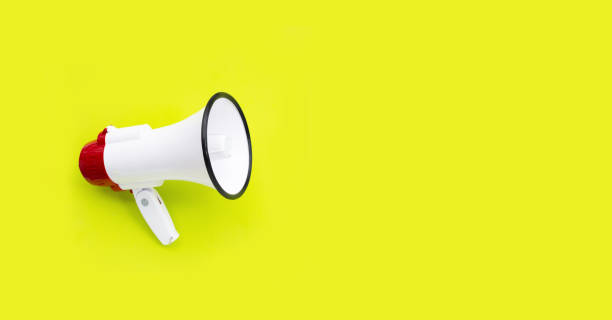 istock Red and white megaphone on green background. 1475647930