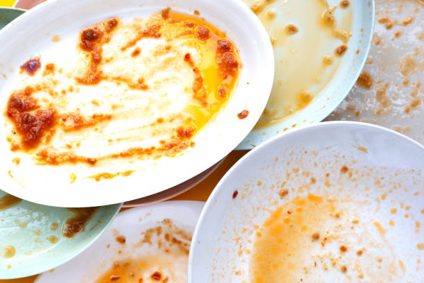 istock Dirty dishes on yellow background. Top view 1475649955