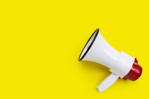 istock Red and white megaphone on yellow background. 1475650379
