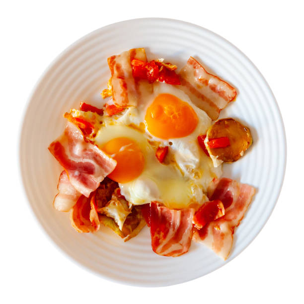 istock Delicious breakfast - scrambled eggs with bacon and french fries closeup 1475651255