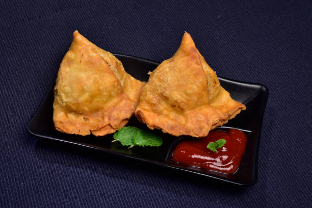 istock Two samosa in plate served with ketchup 1475662116