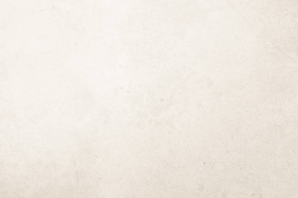 istock Colour old concrete wall texture background. Close Up retro plain cream color cement wall background texture. Design paper vintage parchment element show or advertise or promote product on display. 1475675772