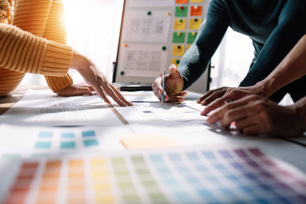 istock Close up view of brainstorm team of creative Web Graphic Designer ux developer and ui designer brainstorming about mobile app interface wireframe design 1475675980
