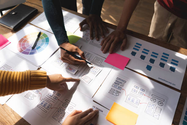 istock Brainstorm team of creative Web Graphic Designer planning, Group of asian mobile phone app developer team meeting for share ideas about screen prototype layout for smartphone, ui, ux startup small business 1475676423