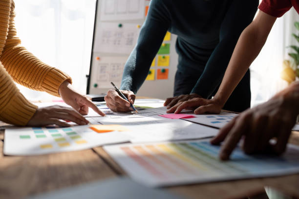 istock Close up view of brainstorm team of creative Web Graphic Designer ux developer and ui designer brainstorming about mobile app interface wireframe design 1475676665