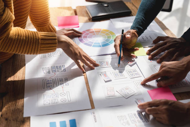 istock Brainstorm team of creative Web Graphic Designer planning, Group of asian mobile phone app developer team meeting for share ideas about screen prototype layout for smartphone, ui, ux startup small business 1475676740