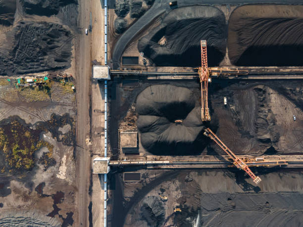 istock Aerial view of machinery working in a coal mine 1475677054