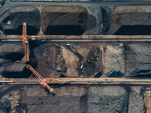 istock Aerial view of machinery working in a coal mine 1475677563