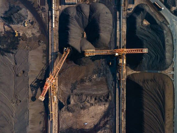 istock Aerial view of machinery working in a coal mine 1475677594