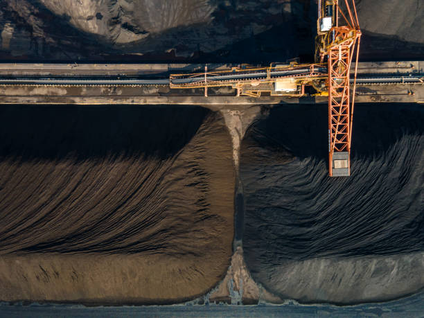 istock Aerial view of machinery working in a coal mine 1475677597