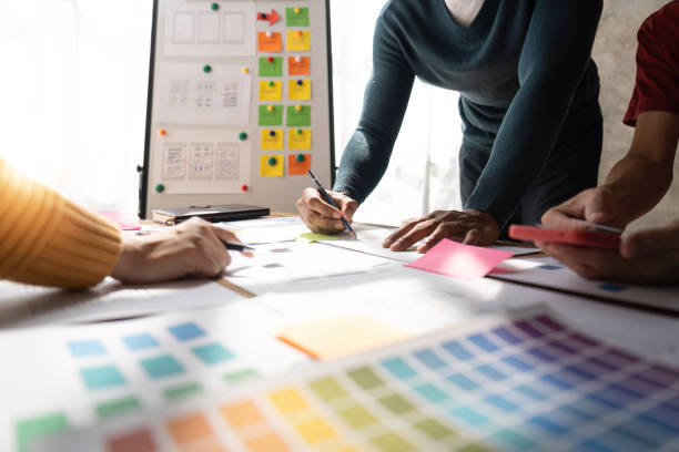 istock Brainstorm team of creative Web Graphic Designer planning, Group of asian mobile phone app developer team meeting for share ideas about screen prototype layout for smartphone, ui, ux startup small business 1475677652