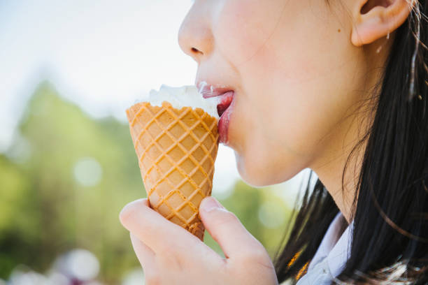 Outdoor portrait of a mature man enjoying an ice pop