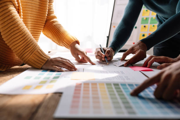 istock Close up view of brainstorm team of creative Web Graphic Designer ux developer and ui designer brainstorming about mobile app interface wireframe design 1475678117