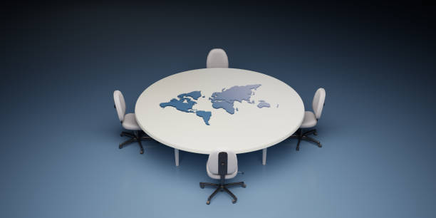 Conference table and chairs with the world map on the board. International politics concept, stock photo