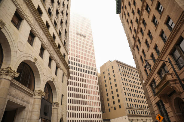 istock skyscraper's towering structure and old-fashioned architecture. multiple stories, with numerous rows of brickwork stacked upon each other to form its exterior walls. The bricks are weathered and worn 1475679112