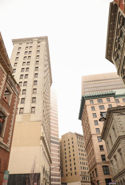 istock skyscraper's towering structure and old-fashioned architecture. multiple stories, with numerous rows of brickwork stacked upon each other to form its exterior walls. The bricks are weathered and worn 1475679150