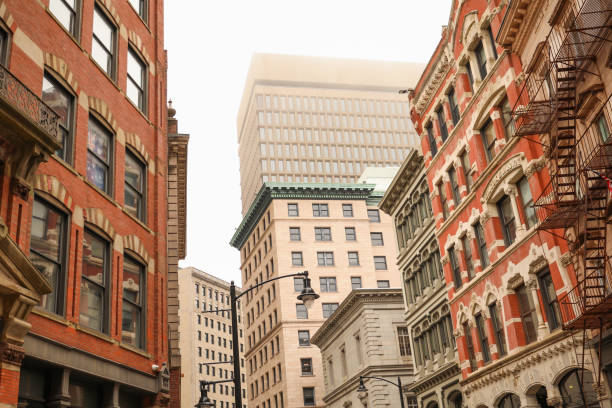 istock skyscraper's towering structure and old-fashioned architecture. multiple stories, with numerous rows of brickwork stacked upon each other to form its exterior walls. The bricks are weathered and worn 1475679207