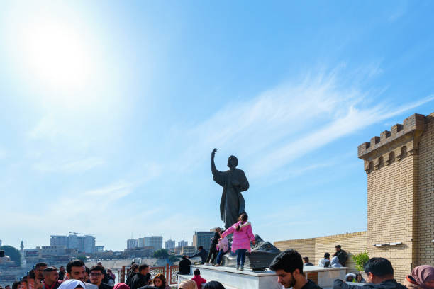 Baghdad, Iraq - Feb 10, 2023: Landscape View of Al-Mutanabi Statue with Visitors Around, Al-Mutanabi was an Abbasid Poet and Considered One of the Top Ten Poets of the Whole Arab Linguistic History.