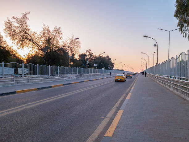 Baghdad, Iraq - Feb 28, 2023: Landscape Wide View of Al-Aimmah Bridge, which Crosses over the Tigris River linking the cities of A'dhamiyyah and Kadhimiyyah.