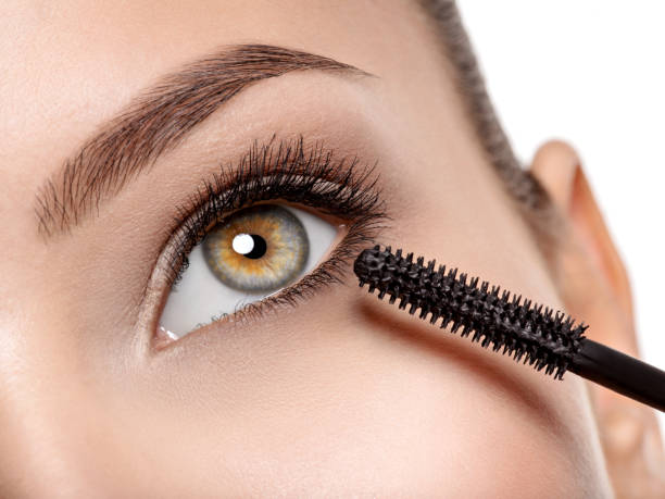 istock women eye with long black eyelashes and makeup brush 1475686637