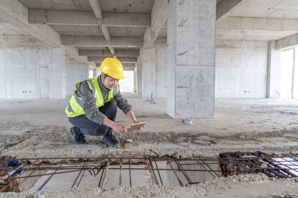 istock A female construction worker inspects the steel ribs on the construction site 1475695308