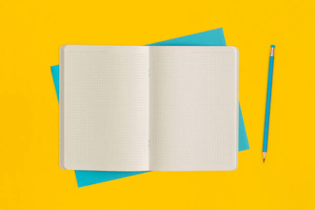 istock Notebook and pencil on yellow background. Top view. Flat lay. Back to school concept. 1475695535