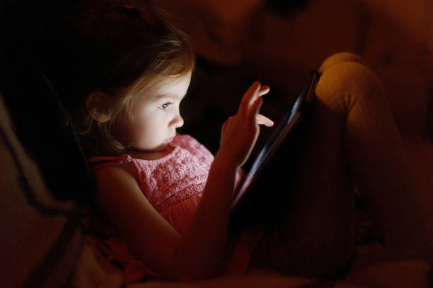 istock Adorable little girl playing on a tablet 1475700840