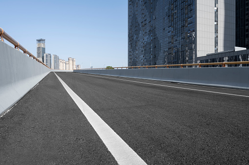 close up on roller on new paved asphalt street