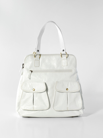 White leather handbag on white background