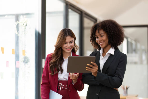 istock Happy businessman in modern office using tablet Planning to analyze financial reports business plan investment financial analysis concept 1475703891