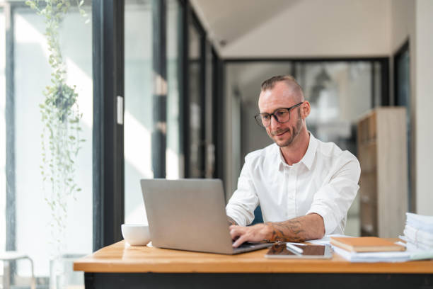 istock Bookkeeper accountant using laptop computer in office, finance and accounting concept 1475721631