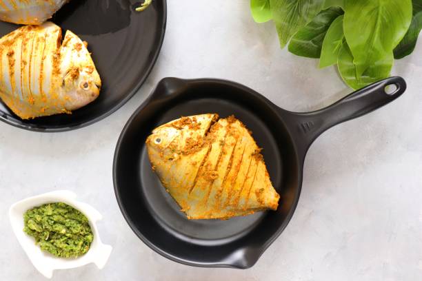 istock Fresh Marinated Pomfret fish or butter fish is cleaned and ready for frying along with spices. ingredients and recipe background with copy space 1475724655
