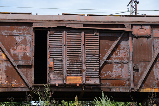 rusty freight car stands on rails in Ukraine