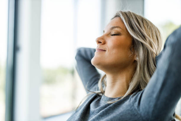 istock Smiling woman resting with her eyes closed. 1475740613