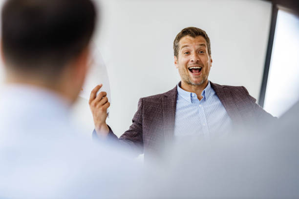 istock Happy businessman feeling satisfied on presentation in the office. 1475740687