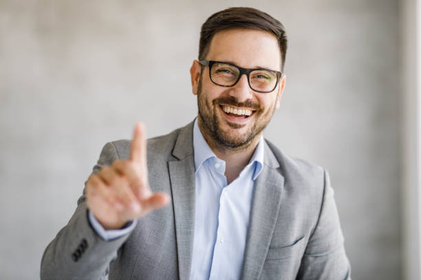 istock Young happy entrepreneur having a conference call. 1475740741