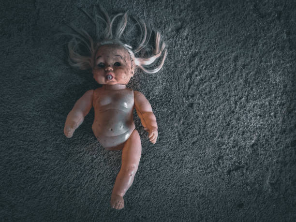 istock Old Doll toy broken spooky looking with copy space area 1475747523
